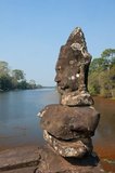 Devas are often seen in opposition to Asuras (sinful deities).<br/><br/>Angkor Thom, meaning ‘The Great City’, is located 1.5km (one mile) north of Angkor Wat. It was built in the late 12th century by King Jayavarman VII, and covers an area of 9 km², within which are located several monuments from earlier eras as well as those established by Jayavarman and his successors. It is believed to have sustained a population of 80,000-150,000 people. At the centre of the city is Jayavarman's state temple, the Bayon, with the other major sites clustered around the Victory Square immediately to the north.<br/><br/>Angkor Thom was established as the capital of Jayavarman VII's empire, and was the centre of his massive building programme. One inscription found in the city refers to Jayavarman as the groom and the city as his bride.<br/><br/>Angkor Thom seems not to be the first Khmer capital on the site, however, as Yasodharapura, dating from three centuries earlier, was centred slightly further northwest.<br/><br/>The last temple known to have been constructed in Angkor Thom was Mangalartha, which was dedicated in 1295. In the following centuries Angkor Thom remained the capital of a kingdom in decline until it was abandoned some time prior to 1609.